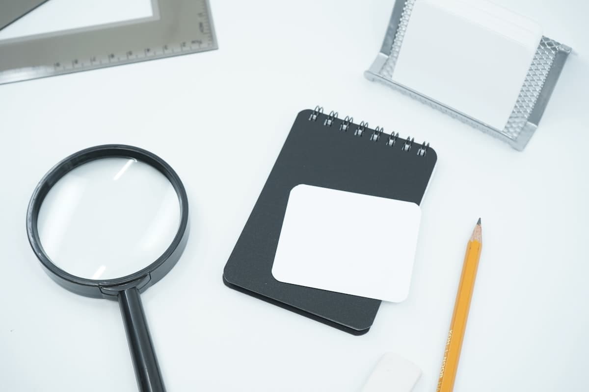 Magnifying glass on a desk, representing field investigation and verification
